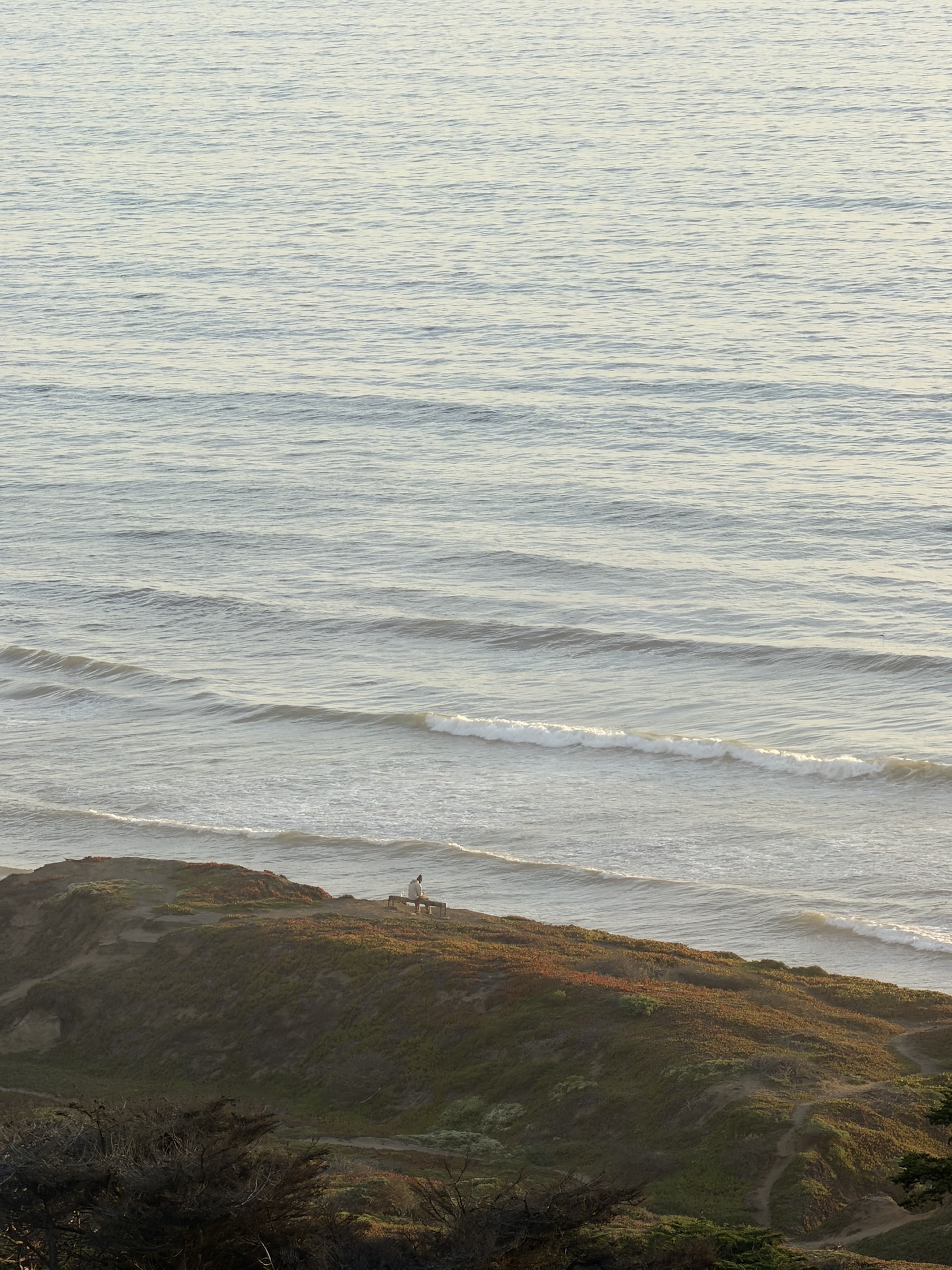 Waves meeting a quiet shoreline